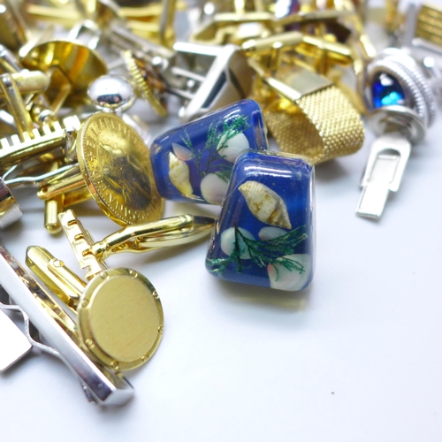 2058 - A large collection of cufflinks and tie-pins