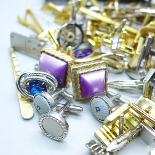 2058 - A large collection of cufflinks and tie-pins