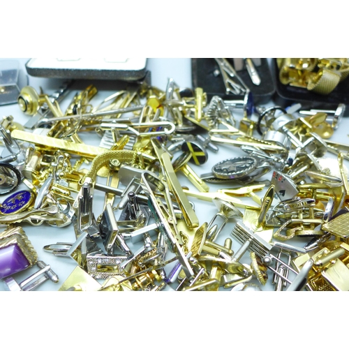 2058 - A large collection of cufflinks and tie-pins