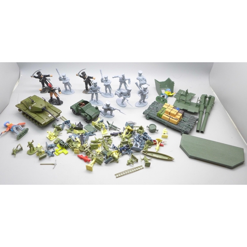 2063 - A collection of toy soldier figures, etc.