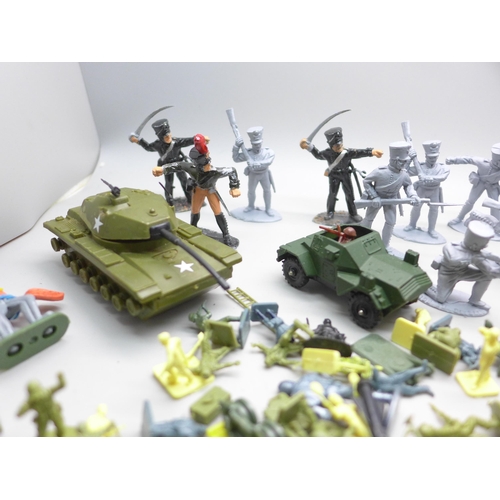 2063 - A collection of toy soldier figures, etc.