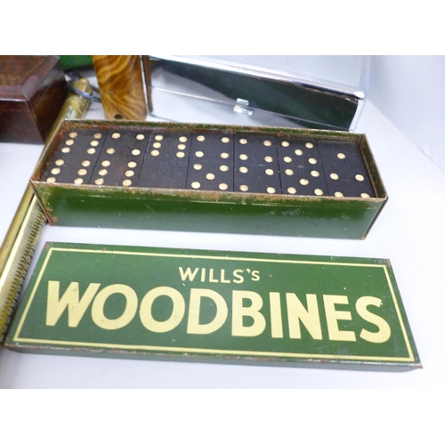 2074 - Two ashtrays, Guiness Stout and Dunhill, a Will's Woodbines tin with dominos and tin-plate cricket g... 