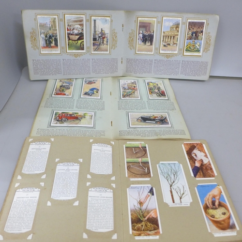 2078 - A collection of cigarette cards, in packets and seventeen albums including 1934 Cricketers, Air Raid... 