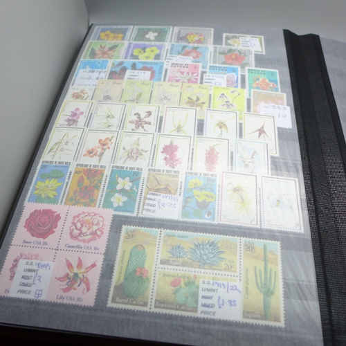 2080 - Stamps; Flowers and orchids thematic stamp collection housed in a large 60 sided padded stock book w... 