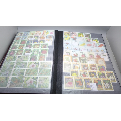 2080 - Stamps; Flowers and orchids thematic stamp collection housed in a large 60 sided padded stock book w... 