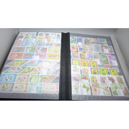 2080 - Stamps; Flowers and orchids thematic stamp collection housed in a large 60 sided padded stock book w... 