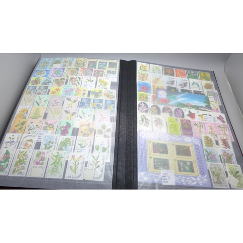 2080 - Stamps; Flowers and orchids thematic stamp collection housed in a large 60 sided padded stock book w... 