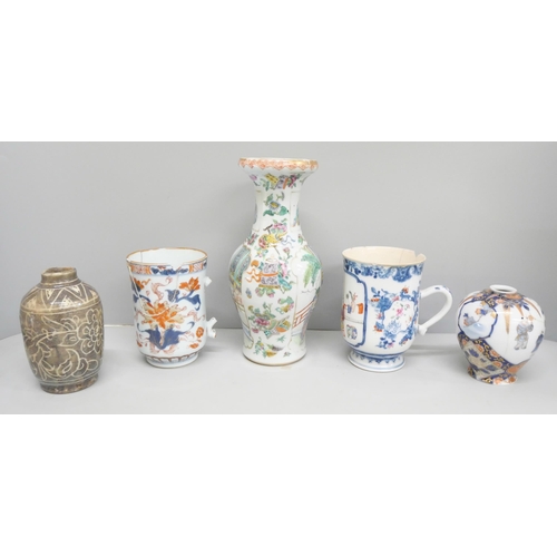 2088 - A collection of oriental pottery and porcelain, vases, tea bowl, etc., two large mugs a/f, globular ... 