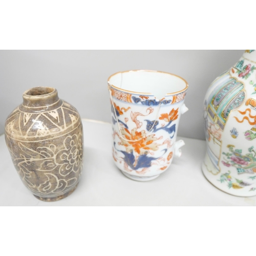 2088 - A collection of oriental pottery and porcelain, vases, tea bowl, etc., two large mugs a/f, globular ... 