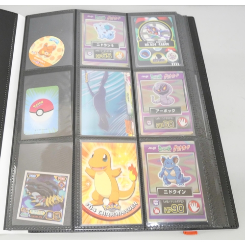 2095 - A collection of Pokémon cards, stickers, Japanese childrens Pokémon, 'shinys', Merlin Pokemon Tattoo... 