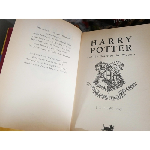 2120 - Harry Potter; A set of four large hardback editions of J.K. Rowling Harry Potter books illustrated b... 