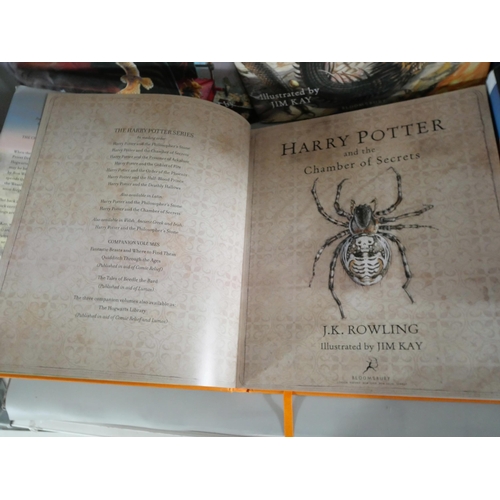 2120 - Harry Potter; A set of four large hardback editions of J.K. Rowling Harry Potter books illustrated b... 