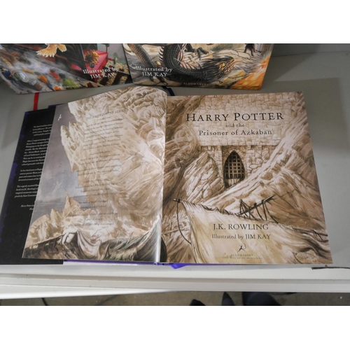 2120 - Harry Potter; A set of four large hardback editions of J.K. Rowling Harry Potter books illustrated b... 