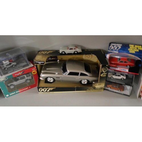 2122 - Six James Bond 007 related model vehicles, including a Q-Branch DB5 motorised-lights-sounds Aston Ma... 