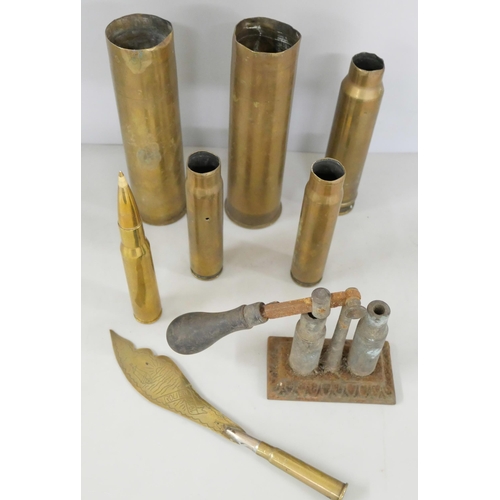 2140 - A collection of brass shell cases, two largest dated 1942