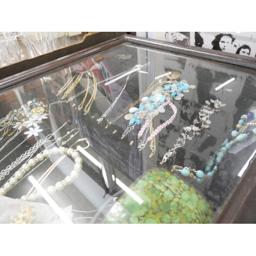 2158 - A display cabinet with costume jewellery including necklaces and hair clips **PLEASE NOTE THIS LOT I... 