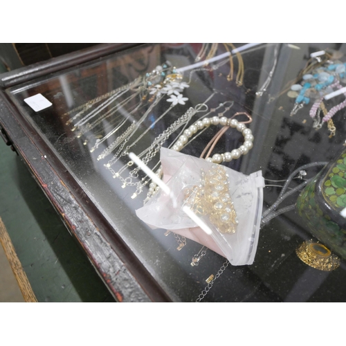 2158 - A display cabinet with costume jewellery including necklaces and hair clips **PLEASE NOTE THIS LOT I... 