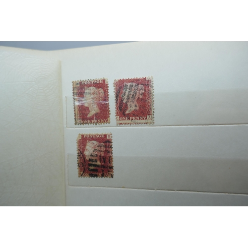 2173 - Stamps; an album containing duplicated stock of Great Britain penny plates