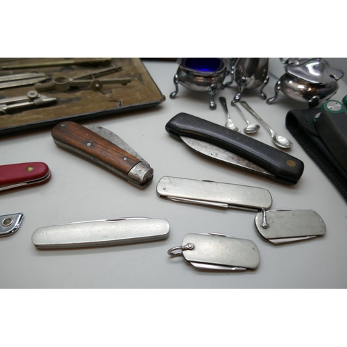 2182 - Eight penknives, a leather cigar case, unused, technical drawing set, not complete, and a plated con... 