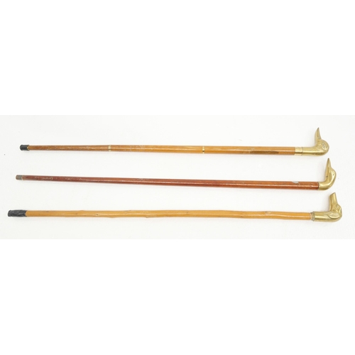 2235 - Three brass duck head walking sticks