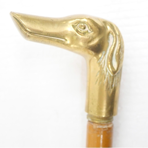 2235 - Three brass duck head walking sticks