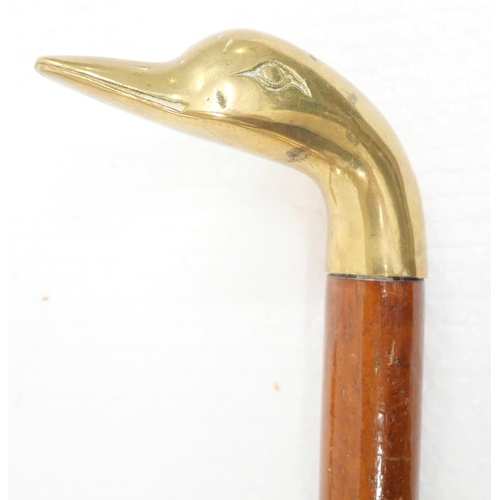 2235 - Three brass duck head walking sticks