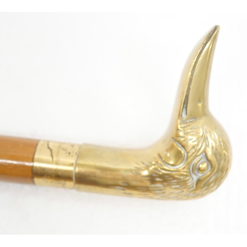 2235 - Three brass duck head walking sticks