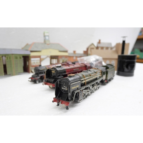 2242 - A collection of railway items including one Tri-ang 00 gauge locomotive and tenders, two model kit l... 