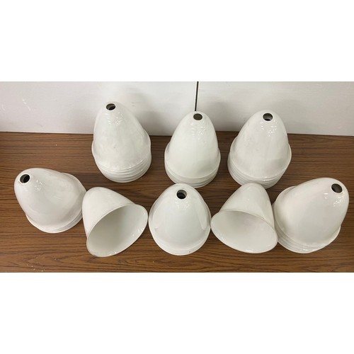 323 - A collection of white enamelled industrial light shades