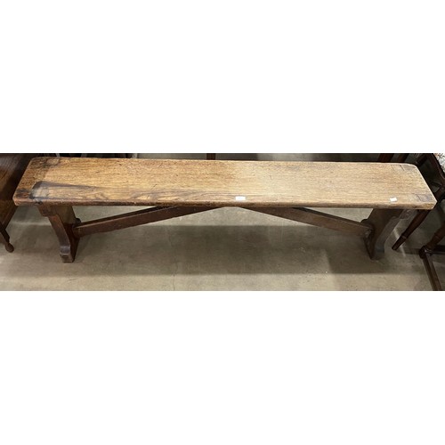 269 - An early 20th Century oak gymnasium bench