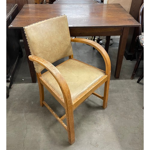 270 - An early 20th Century oak dining table and an Art Deco beech armchair