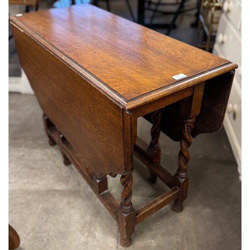 234 - An early 20th Century oak barleytwist gateleg table