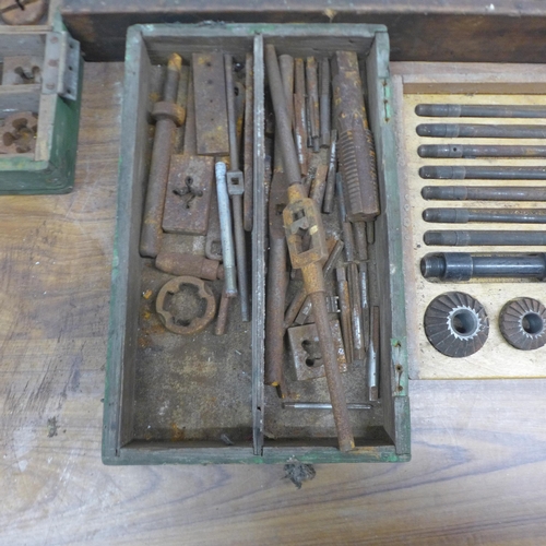 5027 - A large quantity of assorted taps and dies and a set of vintage milling bits