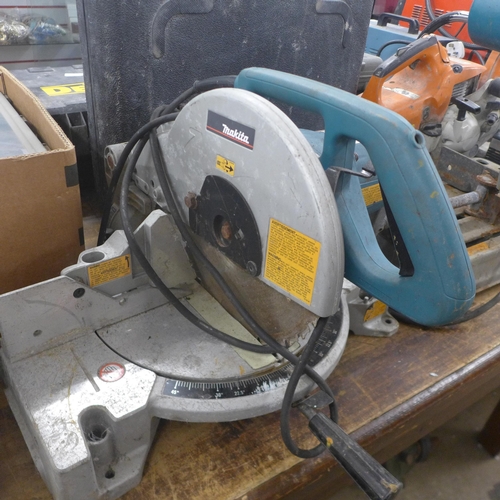 5031 - A Makita LS1040, 240V, 260mm chop saw and Makita 2414NB, 110V, 1650W electric cut-off saw