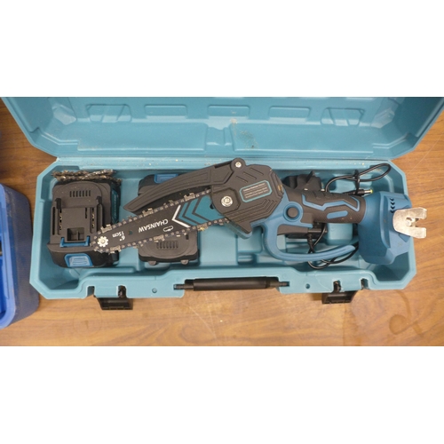 5047 - A mini cordless chain saw in case with two batteries, charger and replacement chain and a Power Mast... 