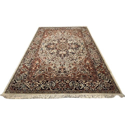 277B - A large eastern brown and cream rug and one other