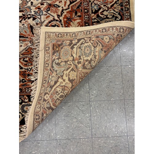 277B - A large eastern brown and cream rug and one other