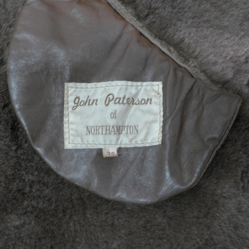 5064 - A vintage John Paterson faux fur lined coat, size 38