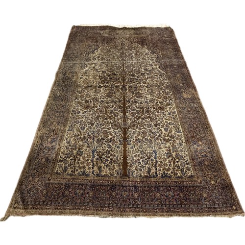 277B - A large eastern brown and cream rug and one other