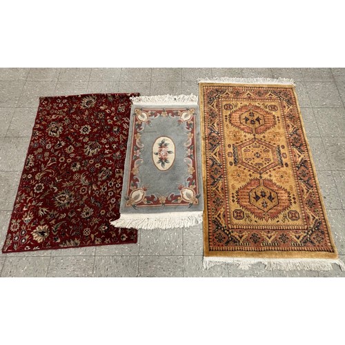 277A - A small Chinese rug and two eastern rugs (128 x 91cms, 110 x 62cms and 158 x 91cms)