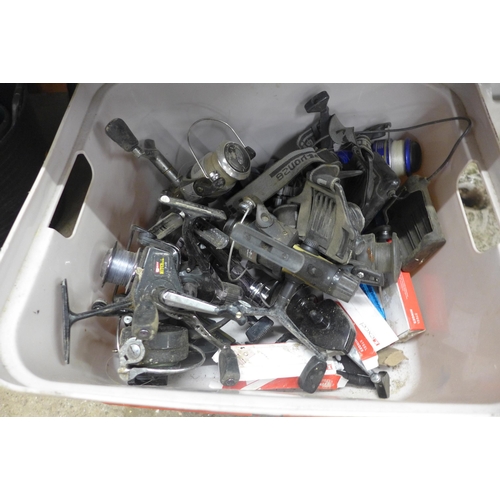 5183 - A collection of assorted fishing reels and two fishing tackle boxes