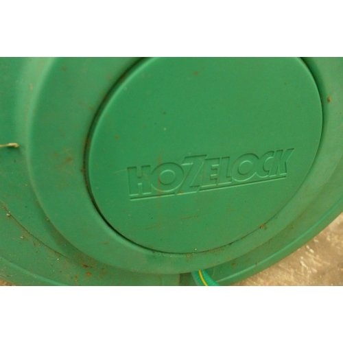 5188 - A Hozelock wall mounted retractable reel and hose