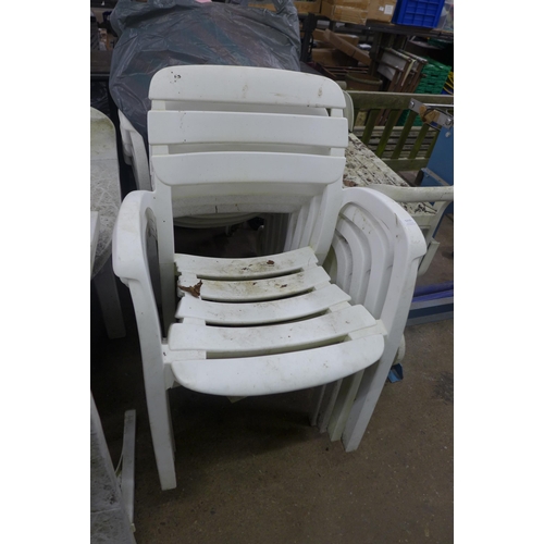 5215 - A white plastic extending garden table with 8 chairs, sun lounger and side trolley table