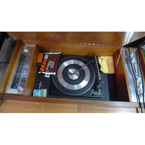 5116 - A vintage G & C music centre with solid state FM stereo tuner and turntable record player stored in ... 