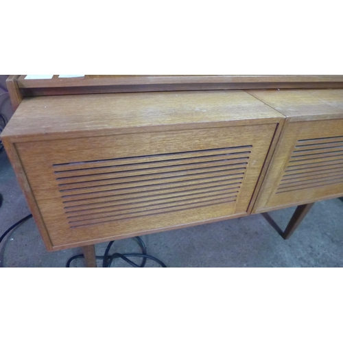 5116 - A vintage G & C music centre with solid state FM stereo tuner and turntable record player stored in ... 