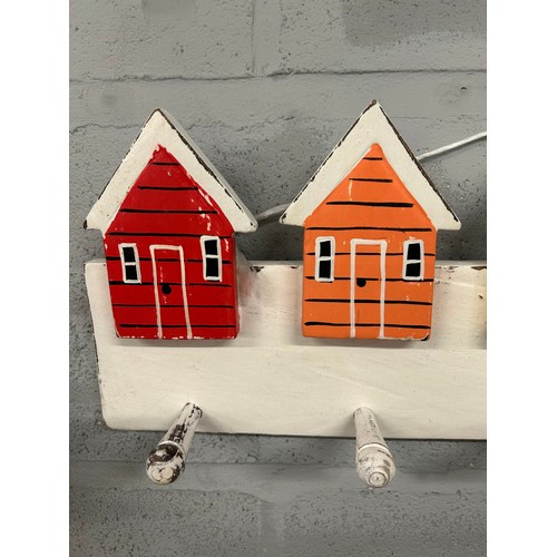 3131 - A pair of beach hut wooden coat racks, (W 62cm)