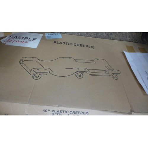 5266 - A boxed sample 40” plastic car creeper* This lot is subject to VAT