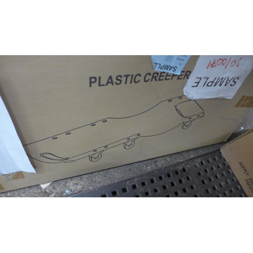 5267 - A boxed sample 36” plastic car creeper* This lot is subject to VAT