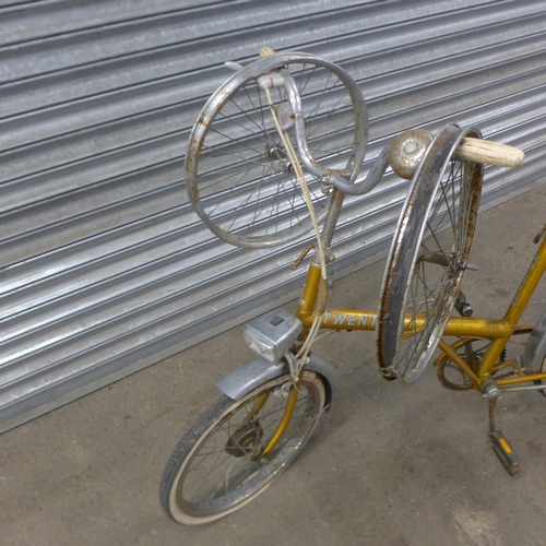 5168 - A vintage Raleigh Twenty folding bike with three spare wheels, front headlight, pannier rack and mud... 