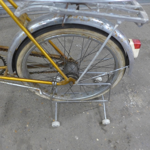 5168 - A vintage Raleigh Twenty folding bike with three spare wheels, front headlight, pannier rack and mud... 